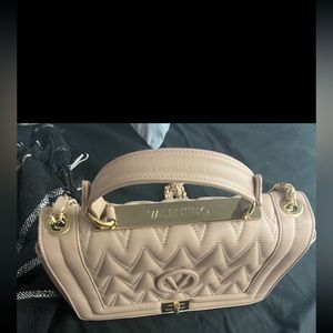 10.75"W x 7"H x 3.5"D
3" handle drop; 19" strap drop
Turnlock 

Leather